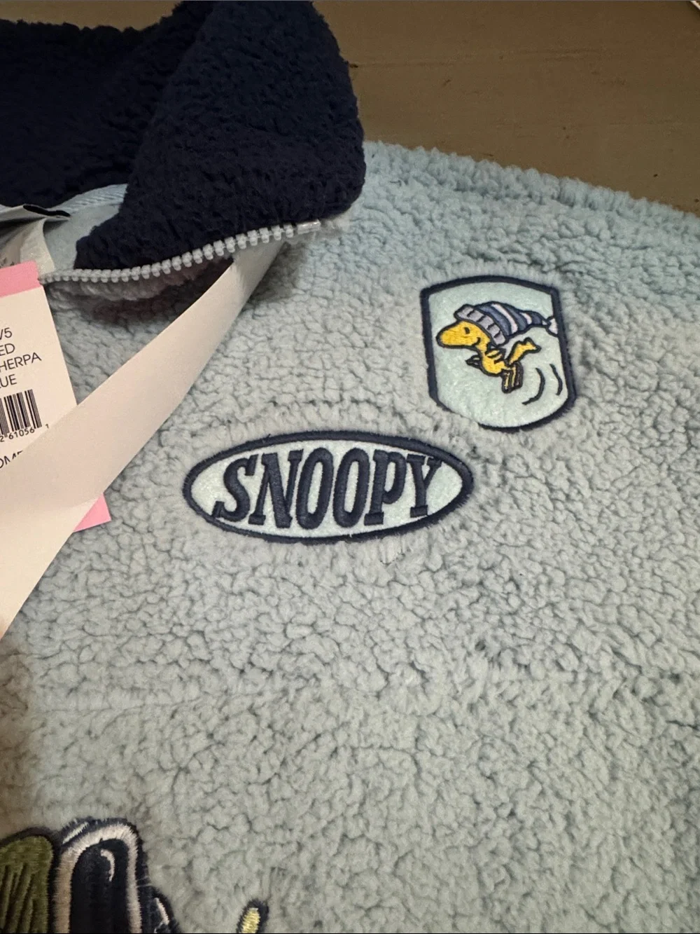 Peanuts Light Blue Sherpa Pullover with Navy Collar and Snoopy Ski Graphic